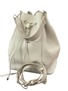 Zara bucket bag in ivory, featuring an adjustable, interchangeable strap.